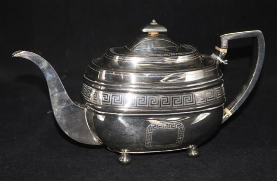 A Scottish George III silver oval teapot, with Greek key engraving, Edinburgh 1808, maker JP, gross 29oz.